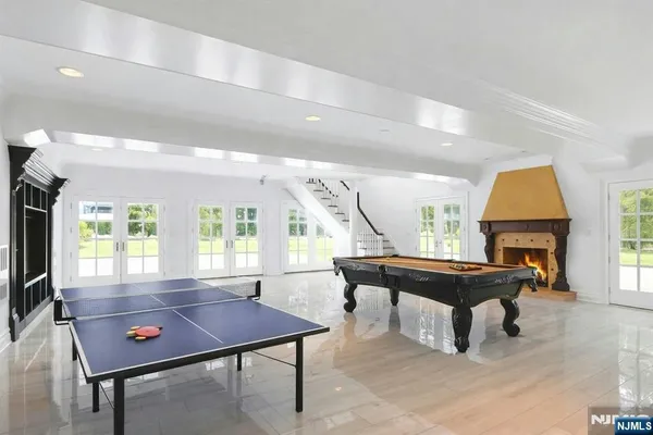 a living room with furniture a table and a large window