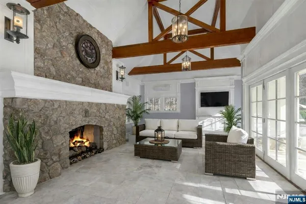 a front view of a house with a yard table and chairs