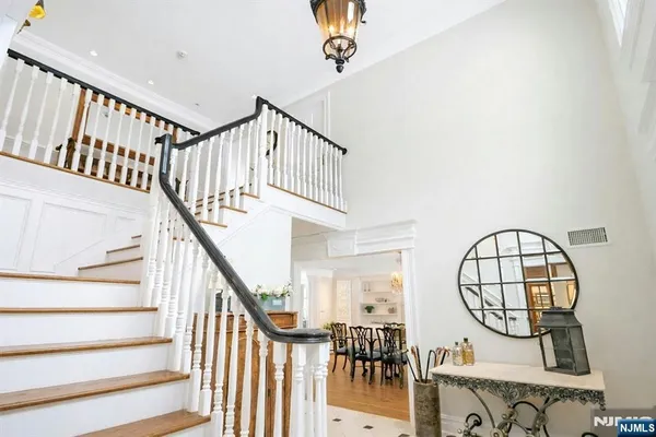 a view of staircase with white walls and a window