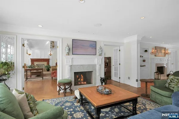 a living room with furniture a table and a fireplace