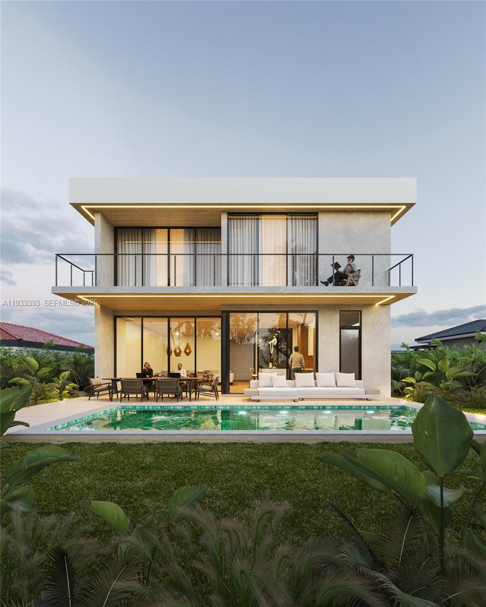 4340 Southwest 10th Street Miami, FL 33134 - Photo 2 of 4 a front view of a house with a yard table and chairs