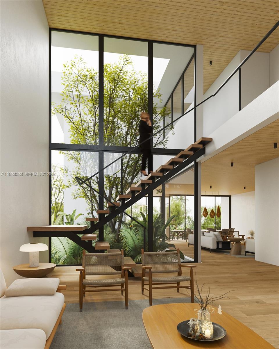 4340 Southwest 10th Street Miami, FL 33134 - Photo 3 of 5 a living room with large glass windows