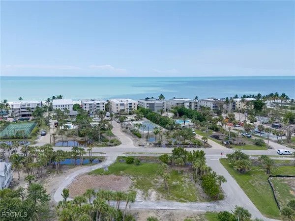 an aerial view of residential building and ocean