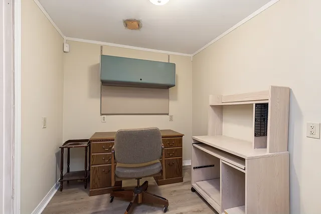 a workspace with furniture and a window