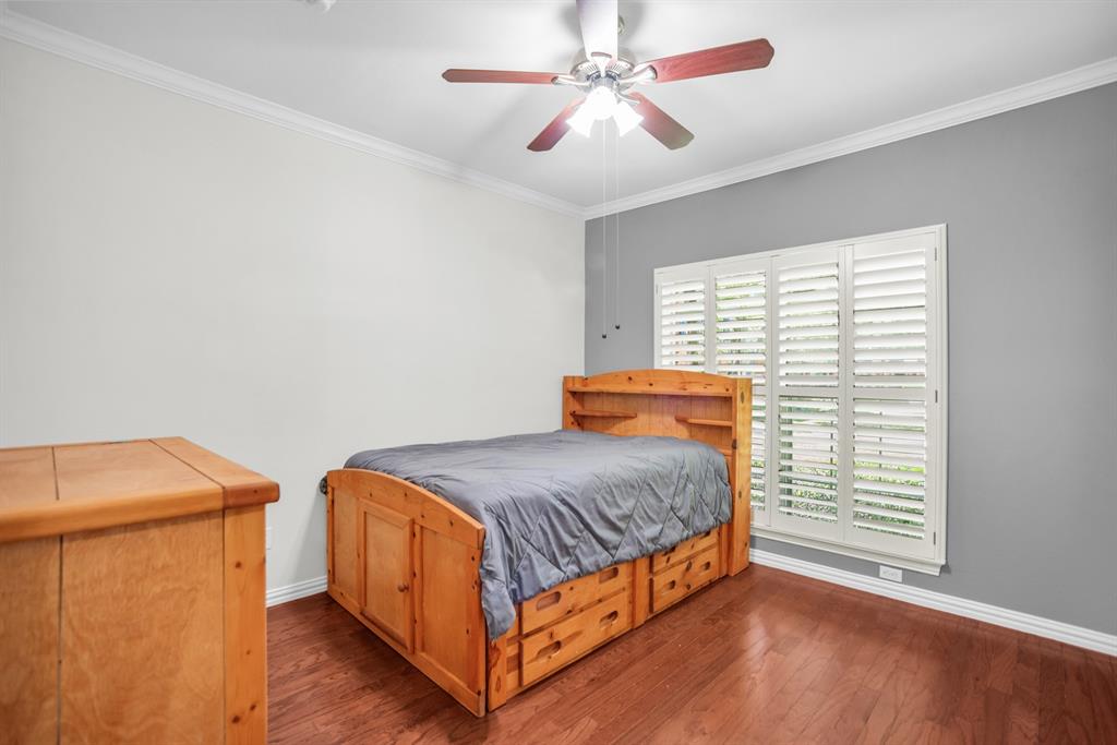 2524 Preston Road, Unit 808 Plano, TX 75093 - Photo 23 of 31 Second bedroom with plantation shutters, hard wood flooring and walk-in closet