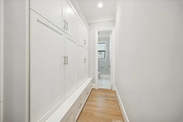 a view of a hallway with white walls