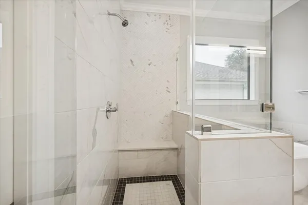 a bathroom with a bathtub and a shower
