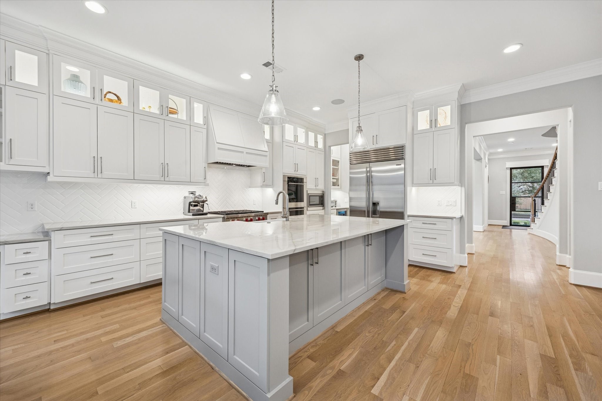 4108 Sunset Boulevard Houston, TX 77005 - Photo 6 of 21 a kitchen with kitchen island granite countertop a sink appliances and cabinets