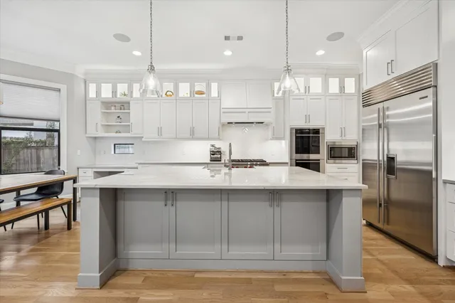 a kitchen with counter top space cabinets and stainless steel appliances