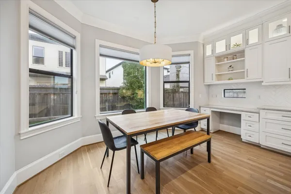 a view of a dining room with furniture window and wooden floor
