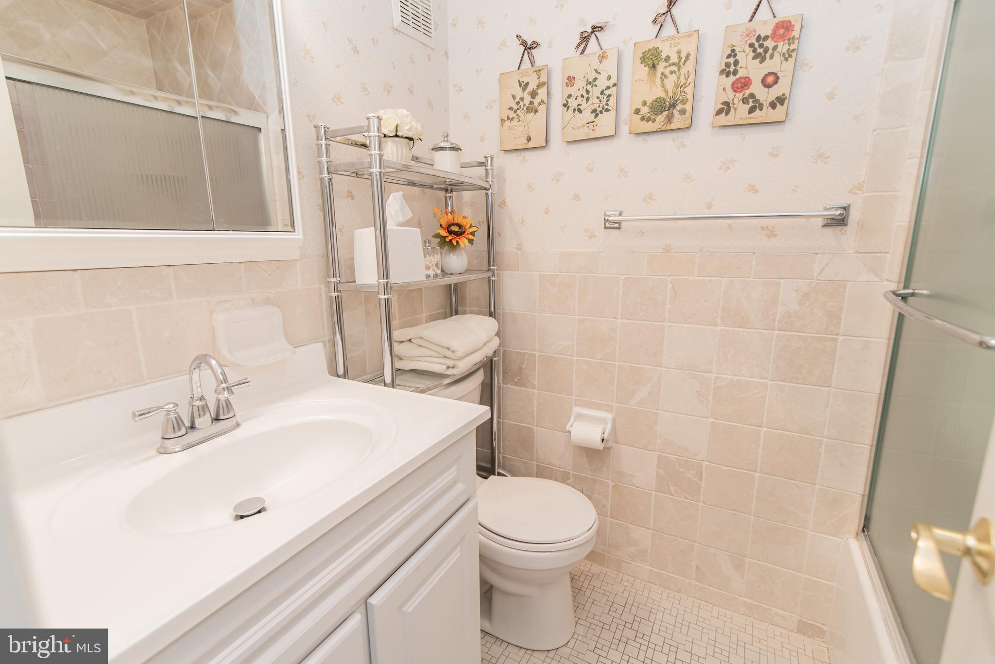3239 Byberry Road Philadelphia, PA 19154 - Photo 35 of 51 a bathroom with a sink mirror vanity and toilet