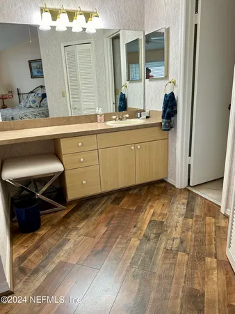 a bathroom with a sink and a mirror