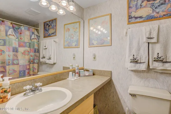 a bathroom with a sink double vanity and a mirror