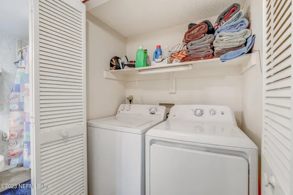 a utility room with dryer and washer