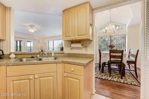 a kitchen with a sink and cabinets