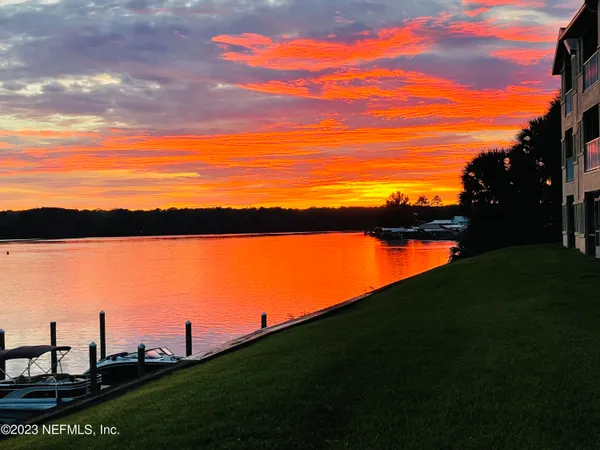 a view of a lake and sunset