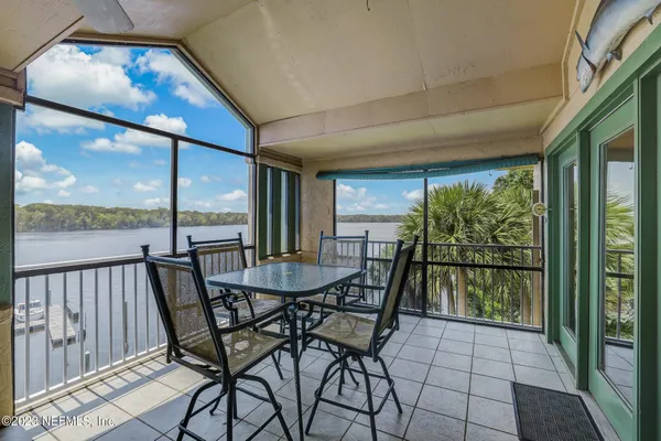 a view of a dining room with furniture window and outside view