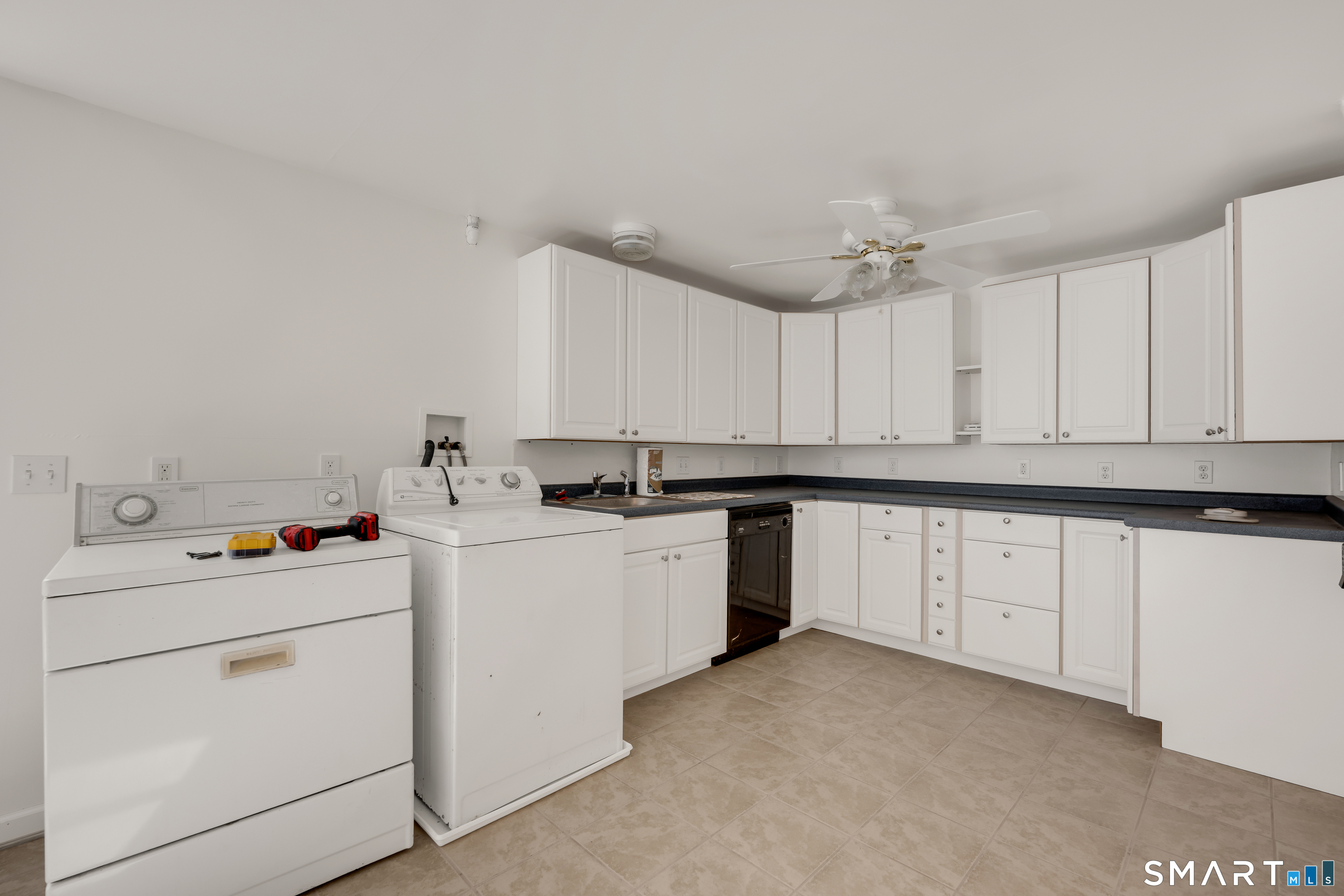 315 West Hill Road Torrington, CT 06790 - Photo 19 of 40 a kitchen with cabinets appliances a sink and a counter top