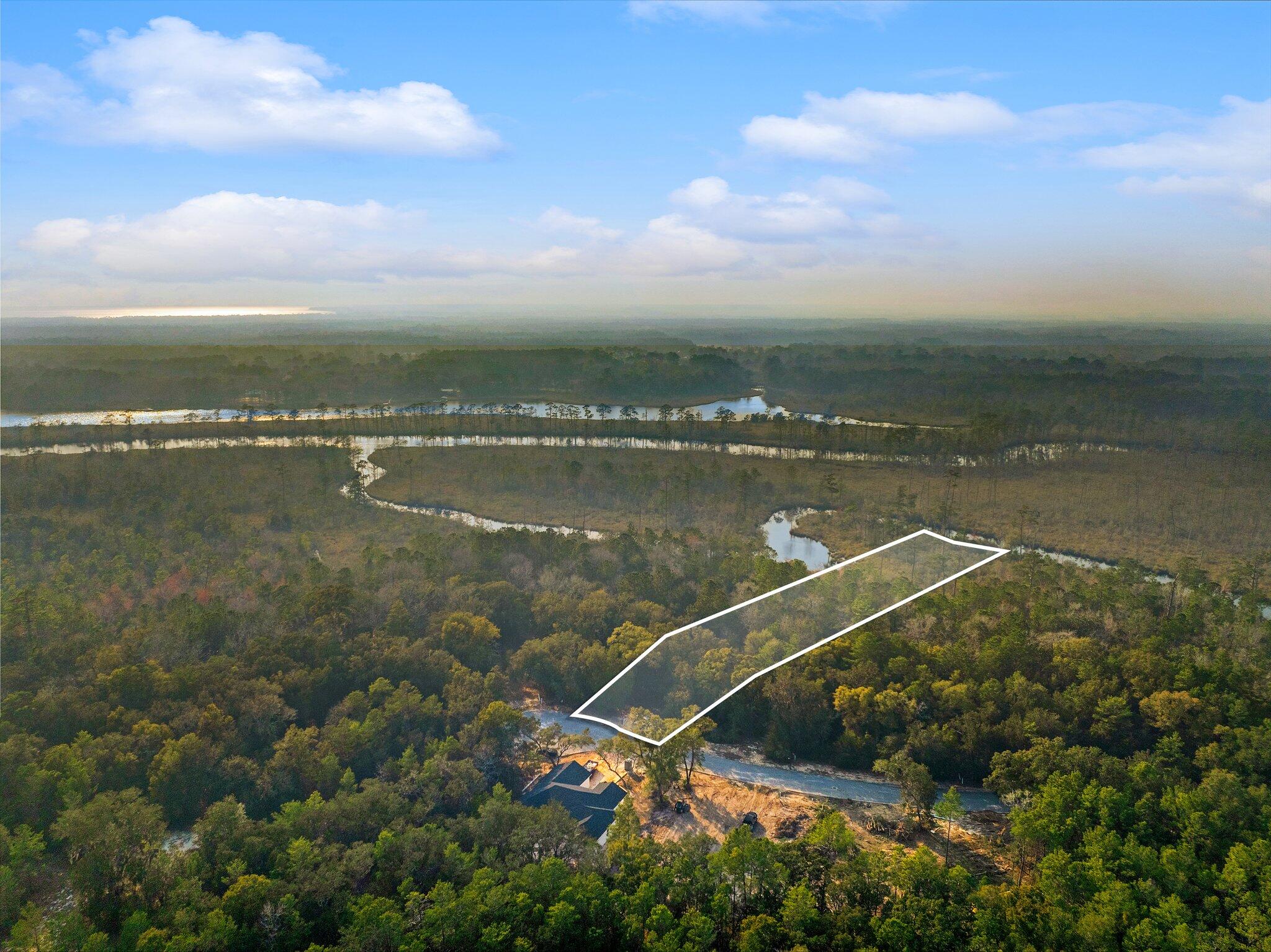 Lot 2 South J Hunter's Way Freeport, FL 32439 - Photo 13 of 16 a view of a lake from a balcony