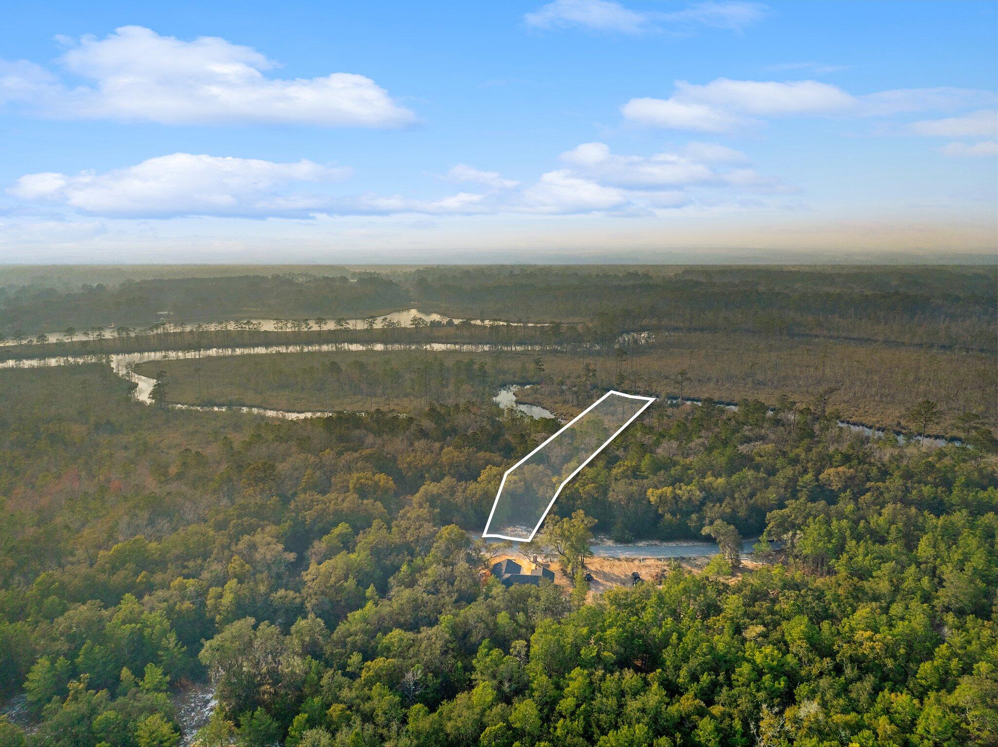 Lot 2 South J Hunter's Way Freeport, FL 32439 - Photo 14 of 16 a view of a lake with a city