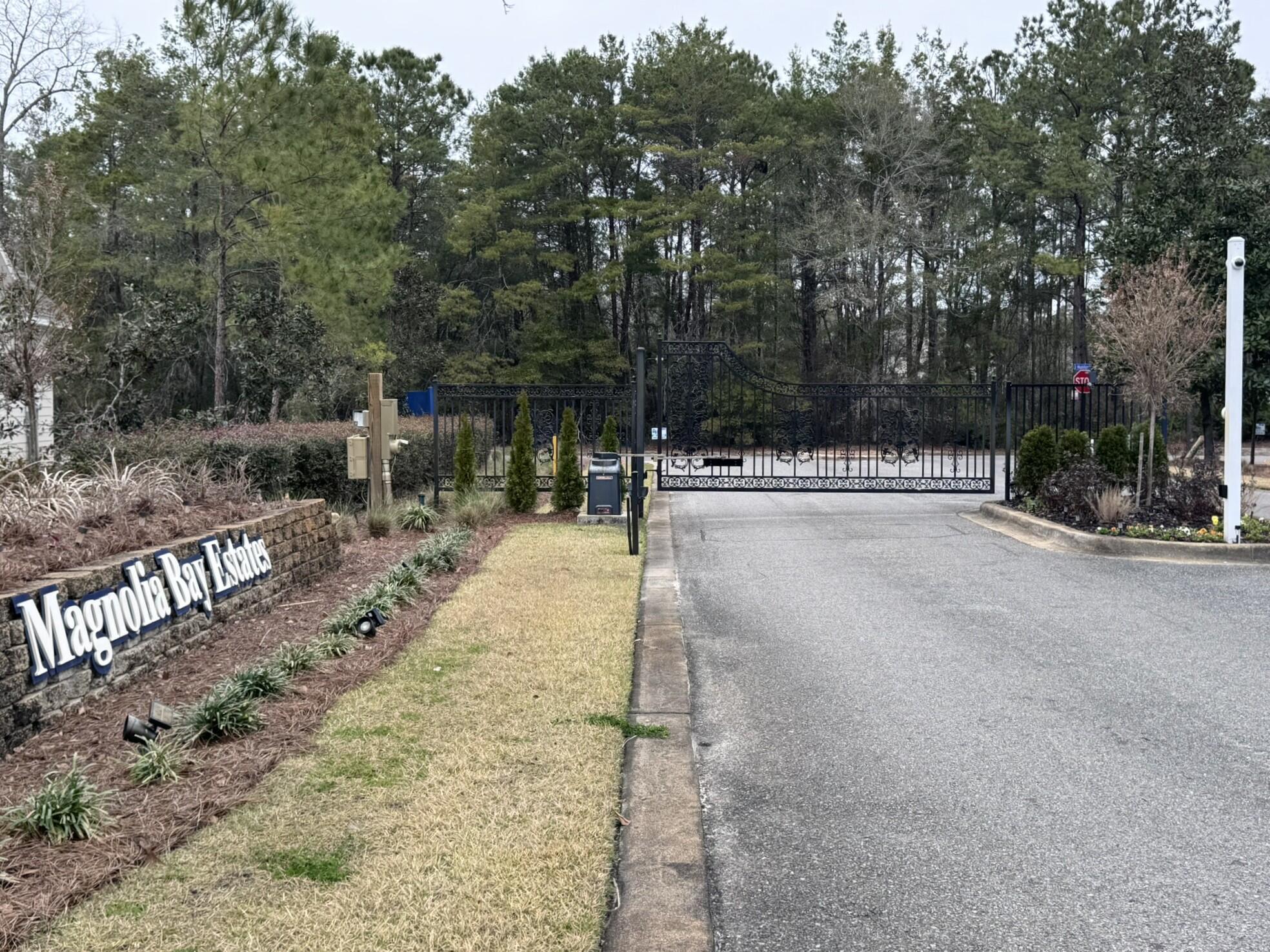 Lot 2 South J Hunter's Way Freeport, FL 32439 - Photo 6 of 16 a wooden bench with trees in the background