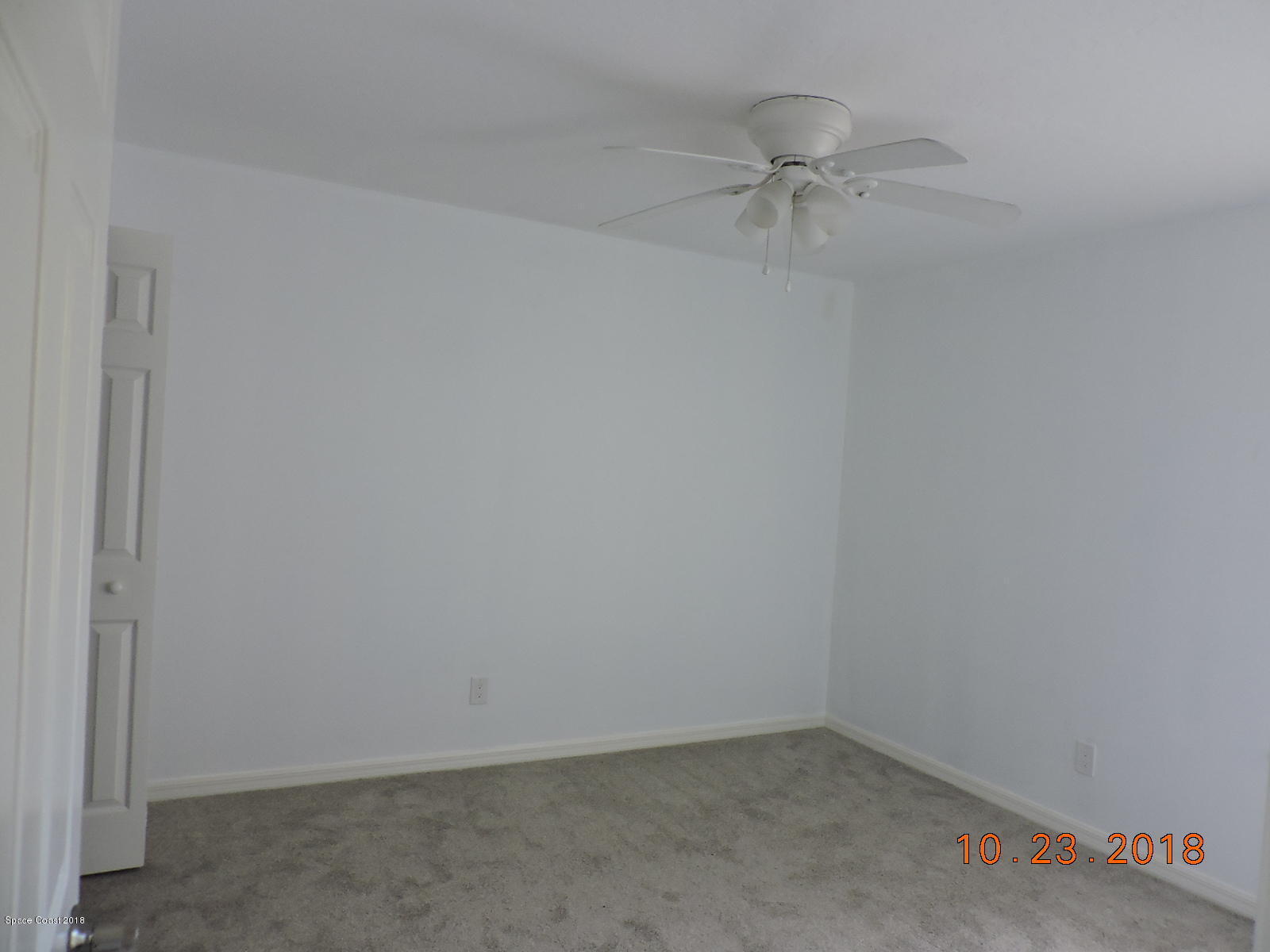 2195 Ladner Road Northeast Palm Bay, FL 32907 - Photo 11 of 14 a view of a room with a ceiling fan and a ceiling fan