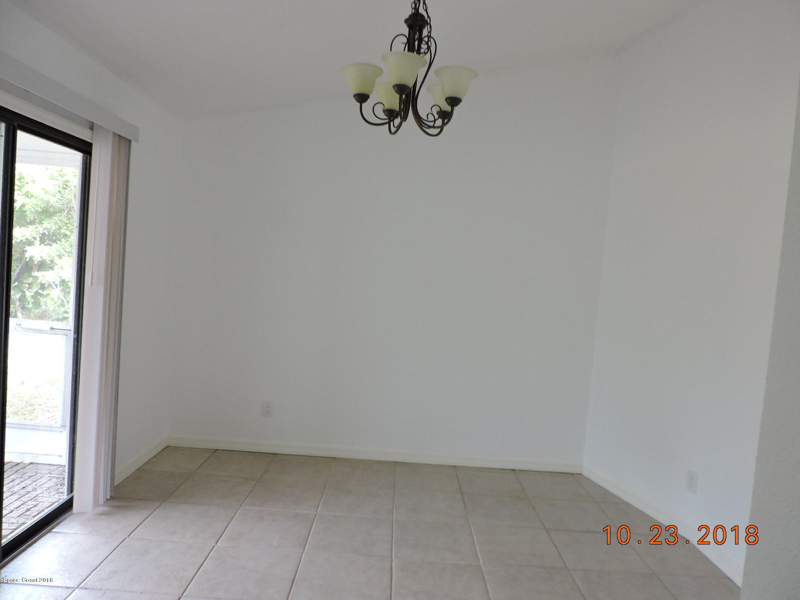 2195 Ladner Road Northeast Palm Bay, FL 32907 - Photo 7 of 14 an empty room with a window