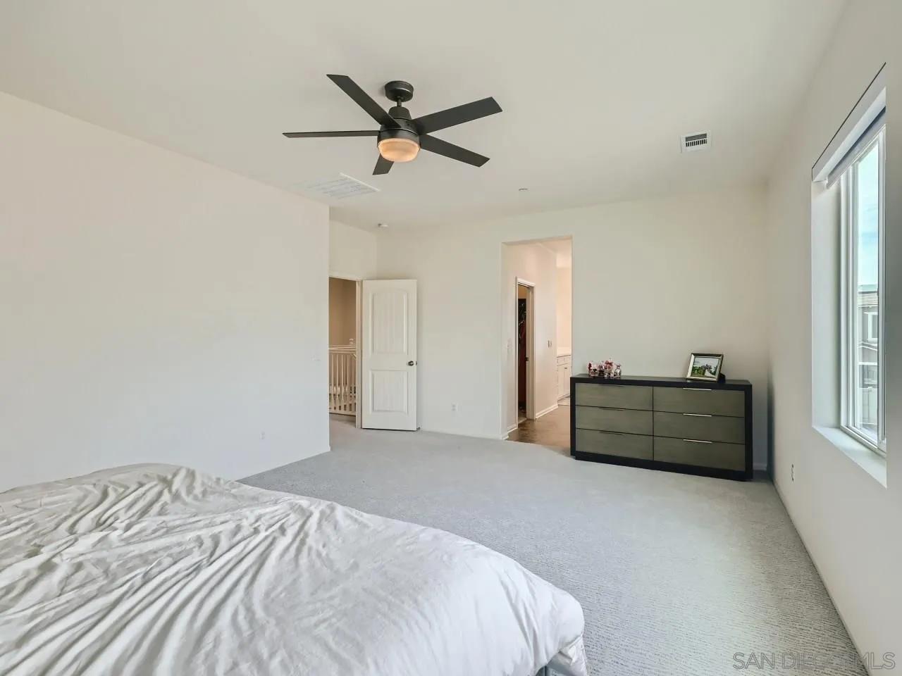 1263 Spivey Road Chula Vista, CA 91913 - Photo 15 of 26 a bedroom with a bed and a window