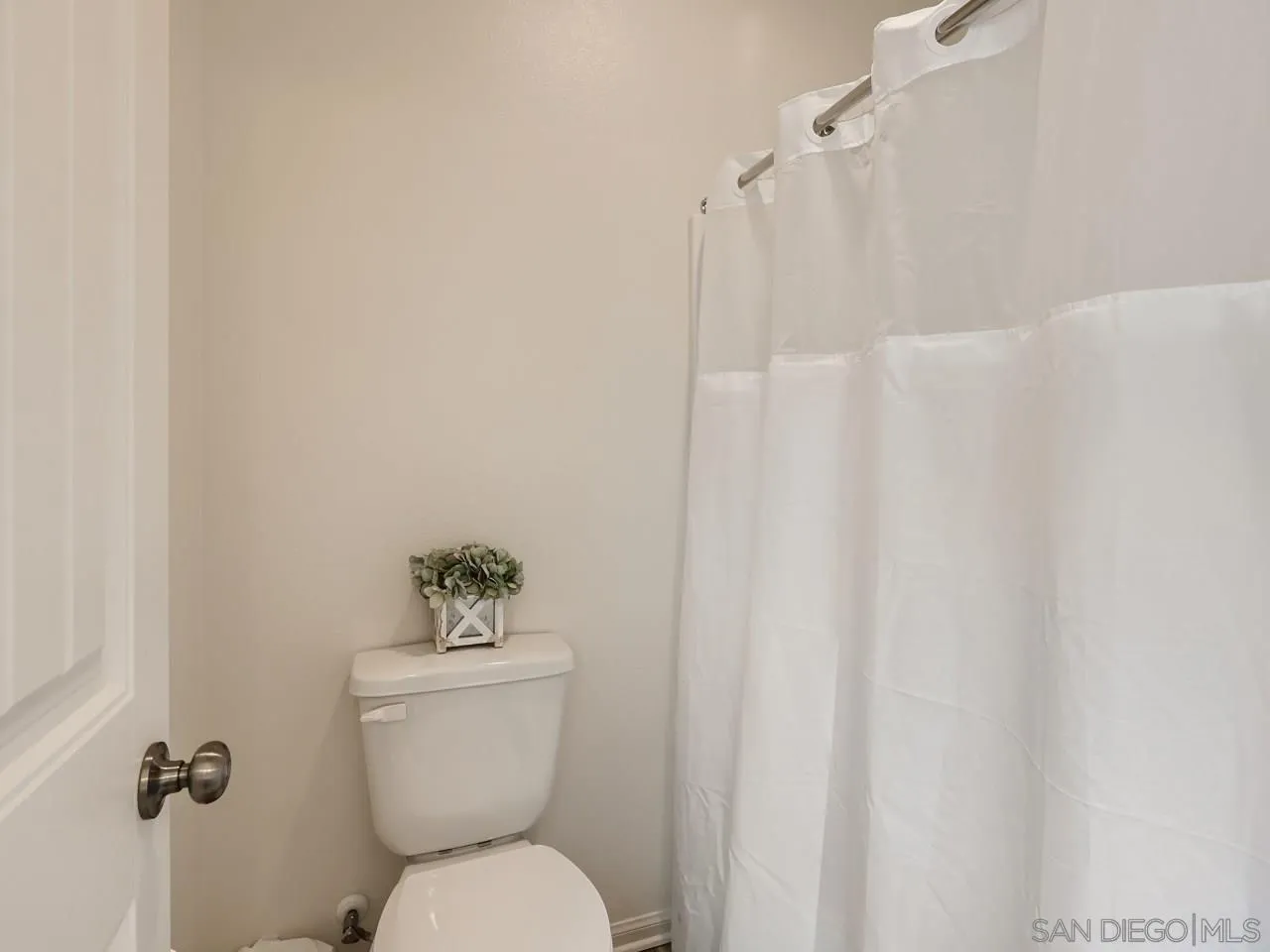 1263 Spivey Road Chula Vista, CA 91913 - Photo 20 of 26 a bathroom with a toilet and a shower