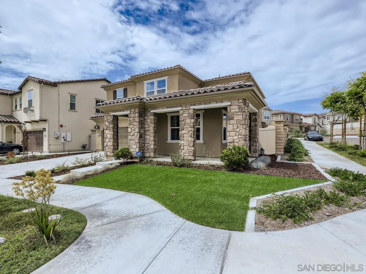 1263 Spivey Road Chula Vista, CA 91913 - Photo 2 of 26 a front view of a house with a garden and plants