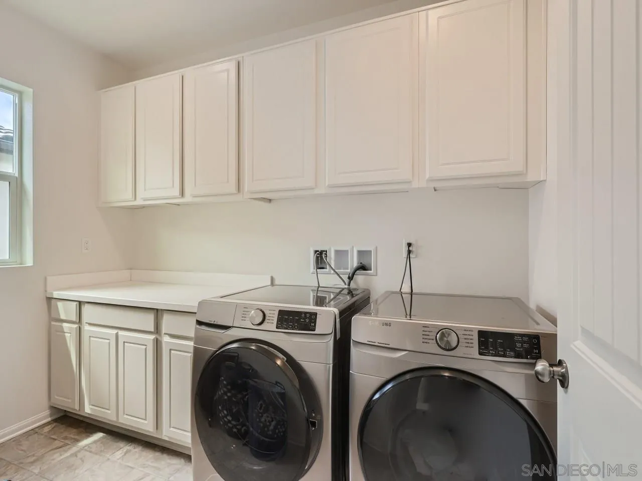 1263 Spivey Road Chula Vista, CA 91913 - Photo 21 of 26 a utility room with dryer and washer
