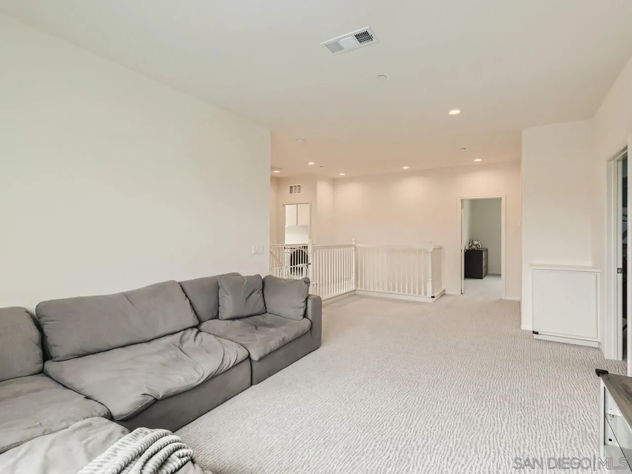1263 Spivey Road Chula Vista, CA 91913 - Photo 23 of 26 a view of a livingroom with furniture and a ceiling fan