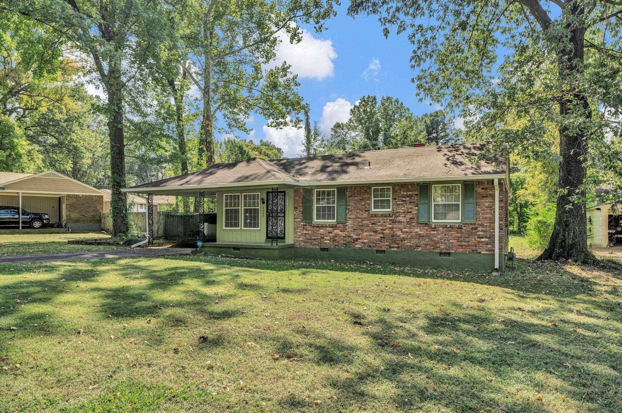 4909 Lochinvar Road Memphis, TN 38116 - Photo 21 of 21 Ranch-style home featuring a carport and a front lawn