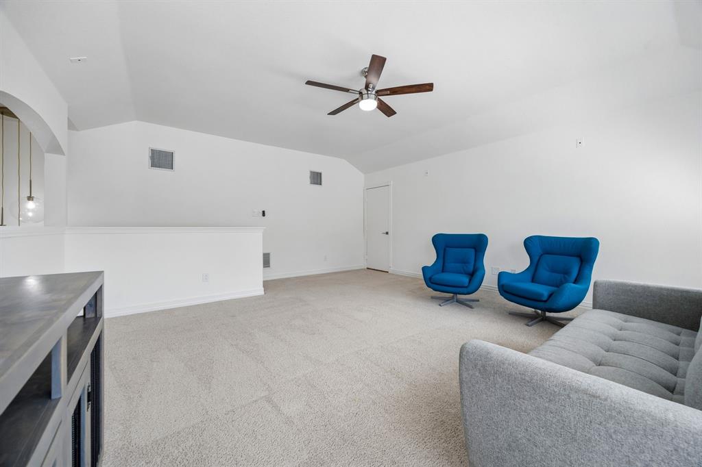 9217 Inverness Drive Rowlett, TX 75089 - Photo 17 of 40 Open Upstairs Gameroom — This large upstairs retreat offers flexible space for movie nights, game tables, hobbies, or a second living area away from the main level.