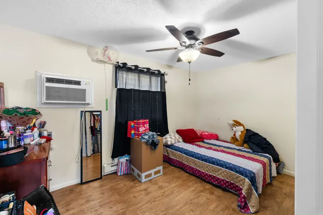 a bedroom with furniture and a window