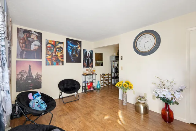 a front view of a house with entryway and wooden floor