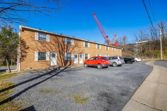 a view of a cars in front of a house
