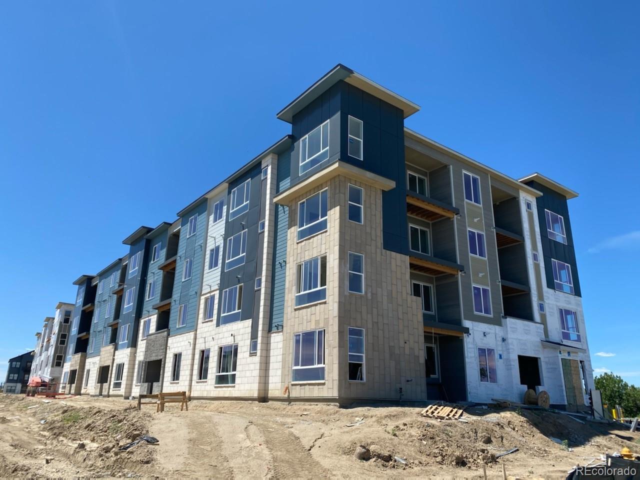 9287 Twenty Mile Road, Unit 301 Parker, CO 80134 - Photo 2 of 3 a front view of a building