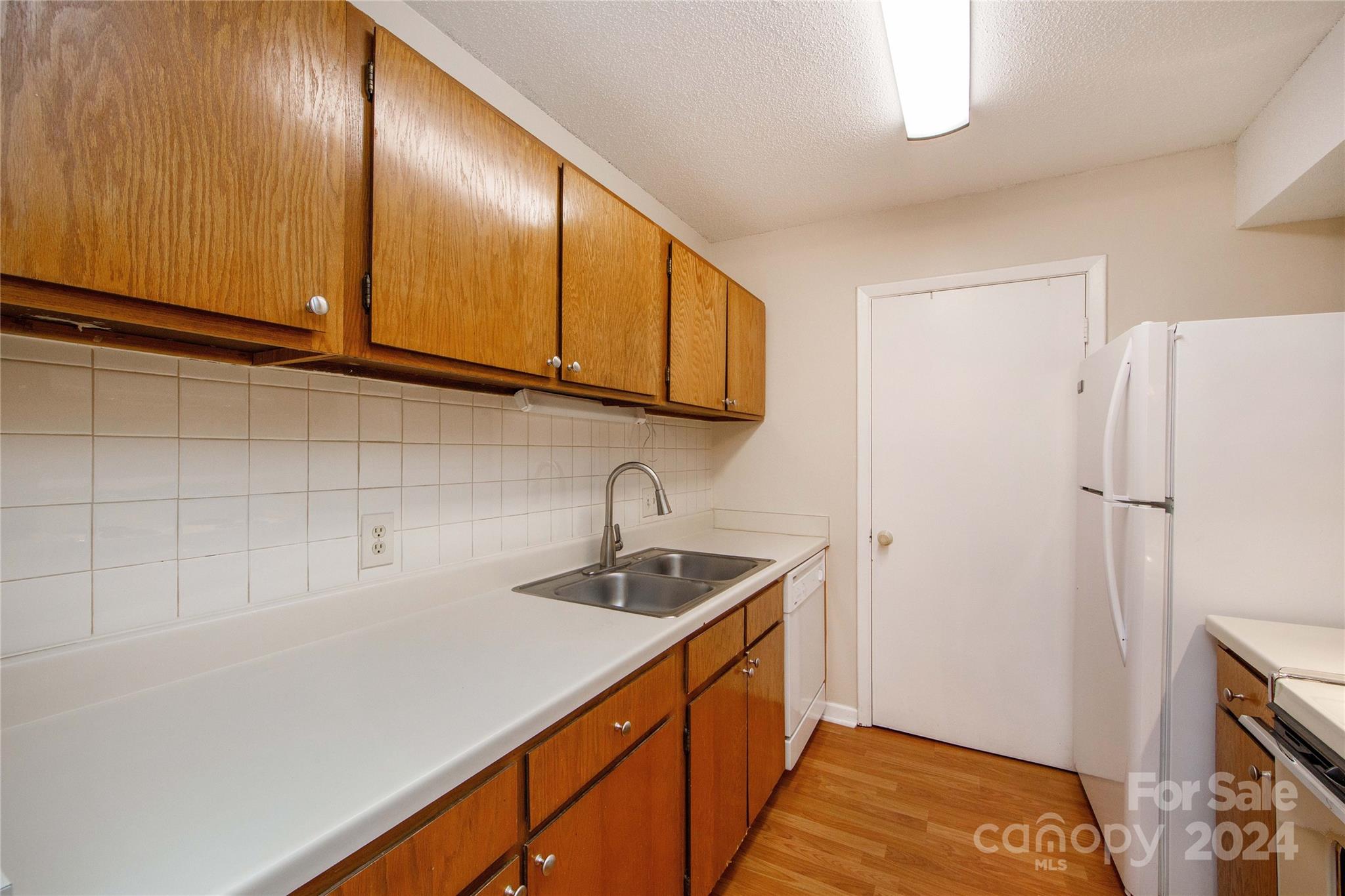 5020 Sardis Road, Unit E Charlotte, NC 28270 - Photo 11 of 27 a kitchen with a sink and cabinets