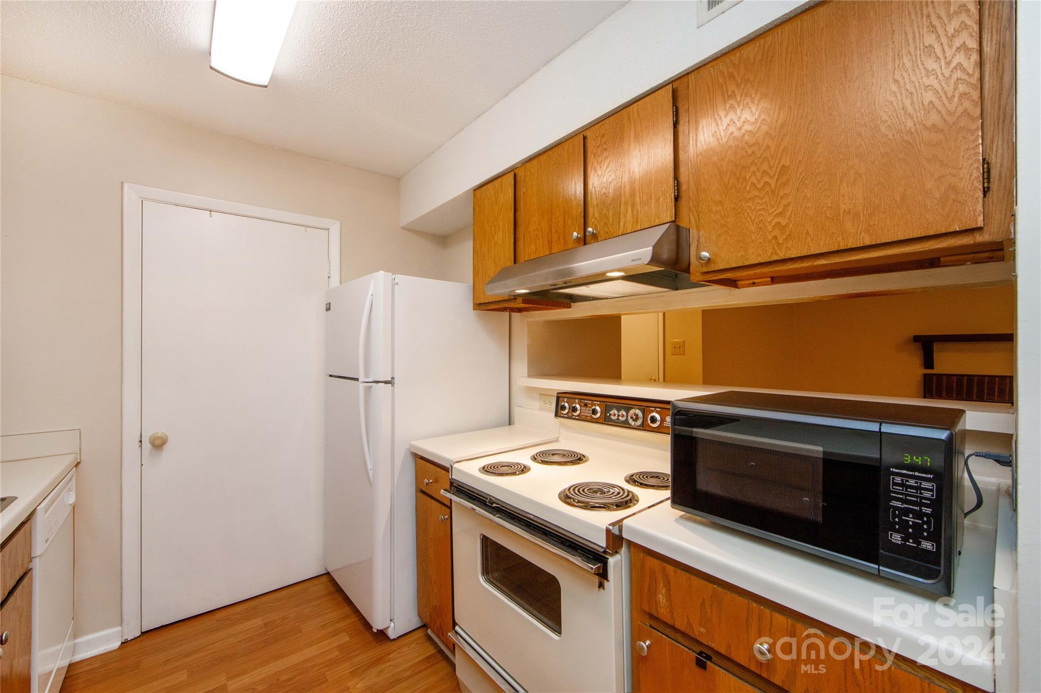 5020 Sardis Road, Unit E Charlotte, NC 28270 - Photo 12 of 27 a view of kitchen with washer and dryer