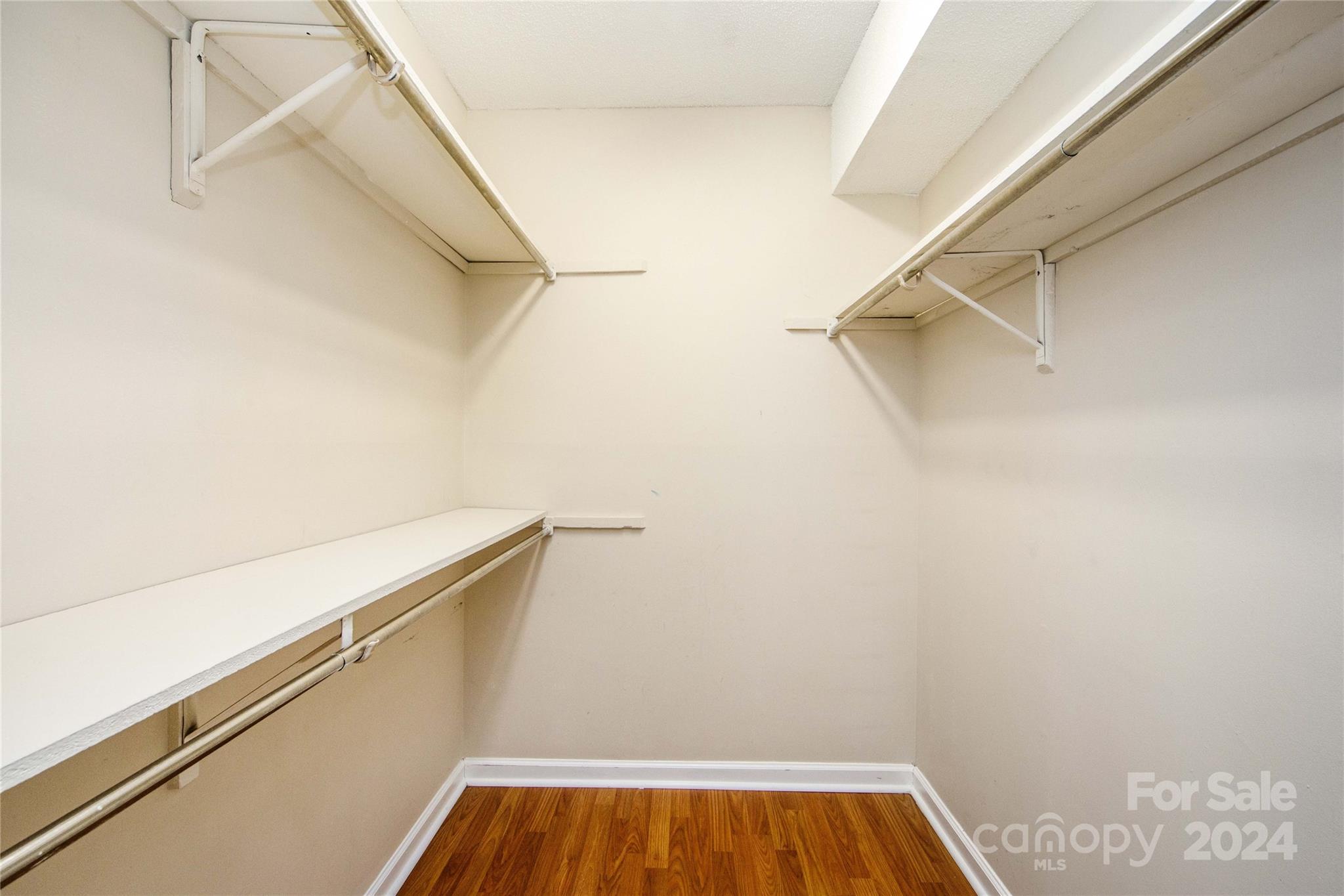 5020 Sardis Road, Unit E Charlotte, NC 28270 - Photo 20 of 27 a view of walk in closet with empty racks