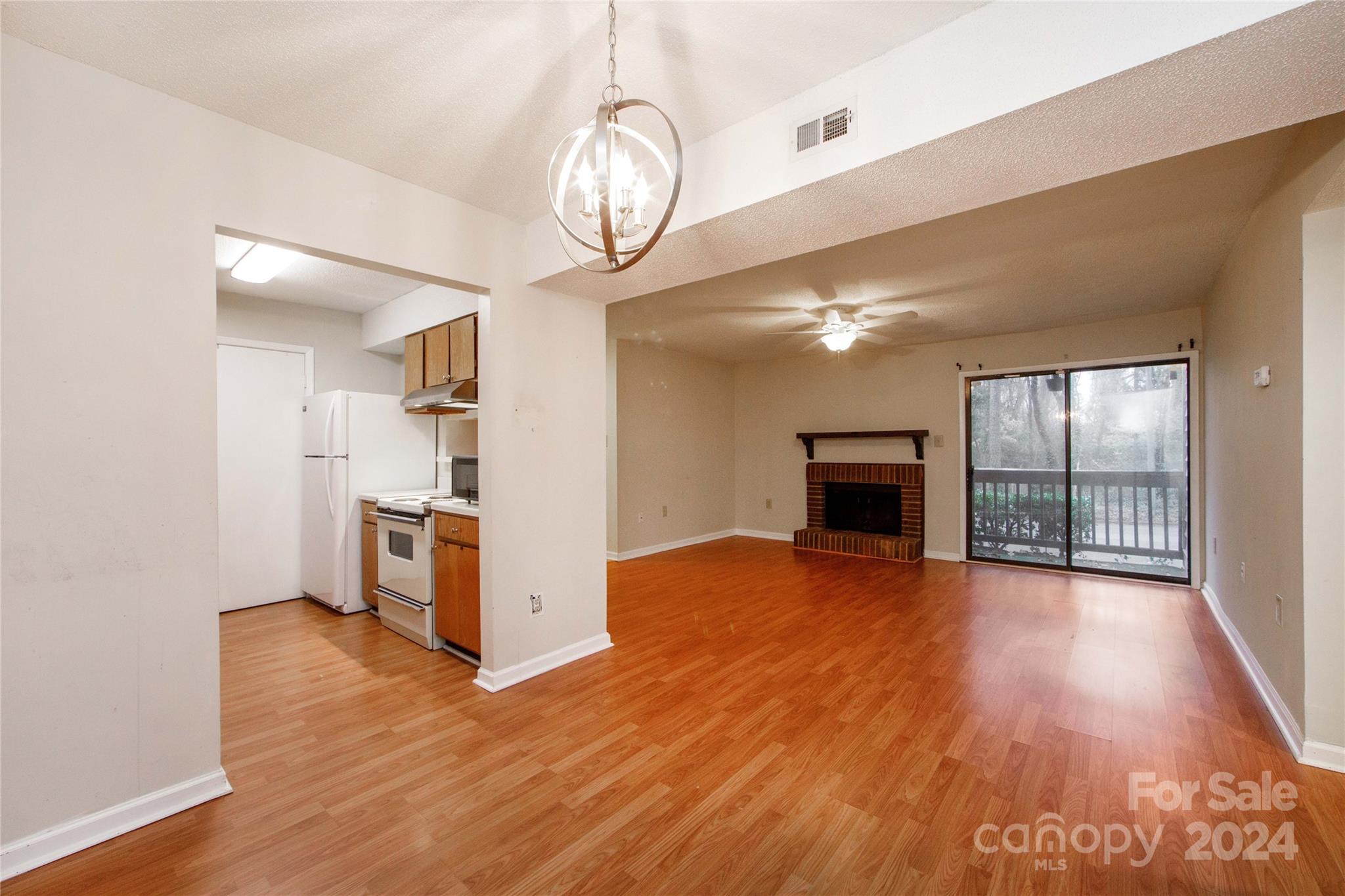 5020 Sardis Road, Unit E Charlotte, NC 28270 - Photo 10 of 27 a view of a livingroom with wooden floor