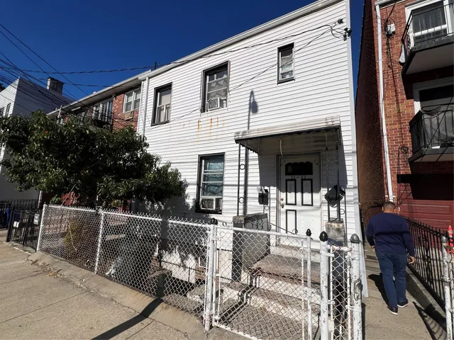 a view of a patio with table and chairs and potted plants