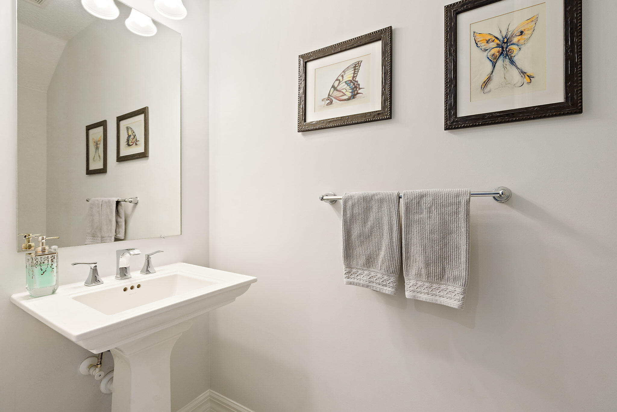 1237 Dakota Drive Jupiter, FL 33458 - Photo 15 of 32 a bathroom with a sink and mirror