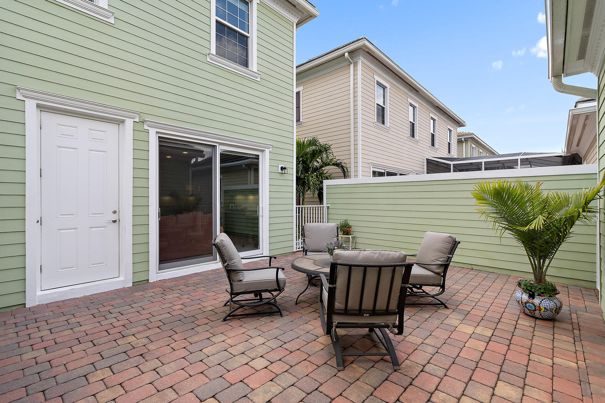 1237 Dakota Drive Jupiter, FL 33458 - Photo 26 of 32 a view of a two chairs in the patio