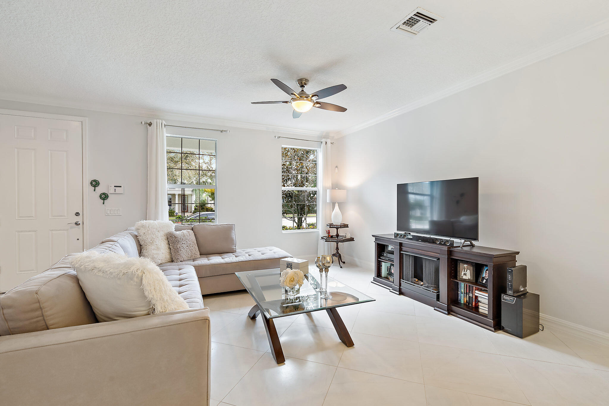 1237 Dakota Drive Jupiter, FL 33458 - Photo 8 of 32 a living room with furniture and a flat screen tv