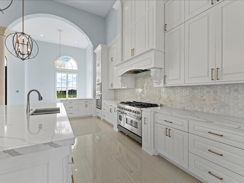 112 Yellow Rose Street Lorena, TX 76655 - Photo 13 of 42 a kitchen with white cabinets and white appliances
