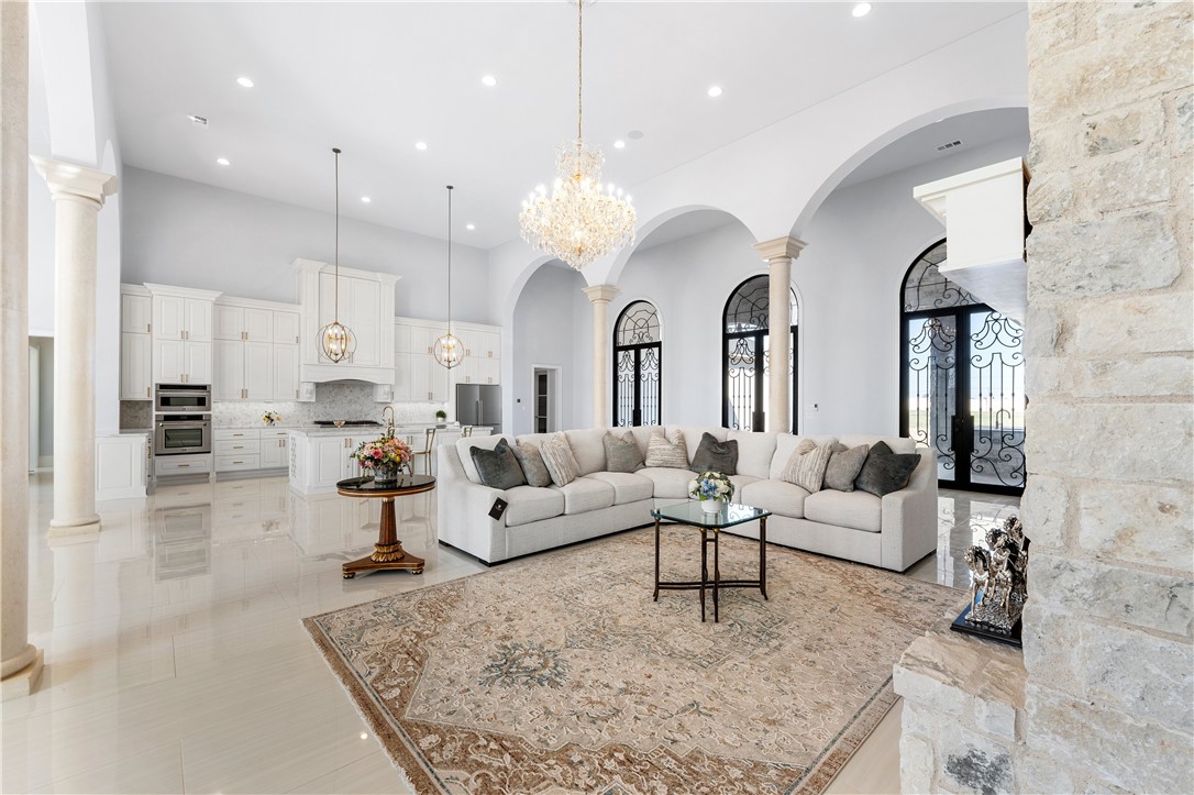 112 Yellow Rose Street Lorena, TX 76655 - Photo 14 of 42 a living room with furniture and a chandelier