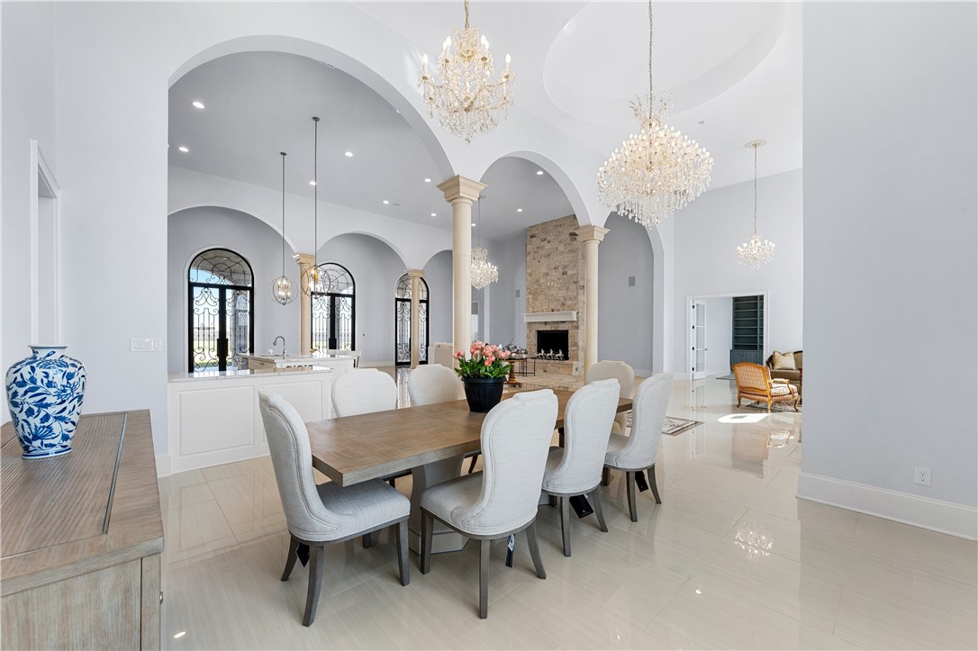 112 Yellow Rose Street Lorena, TX 76655 - Photo 15 of 42 a view of a dining room with furniture and chandelier