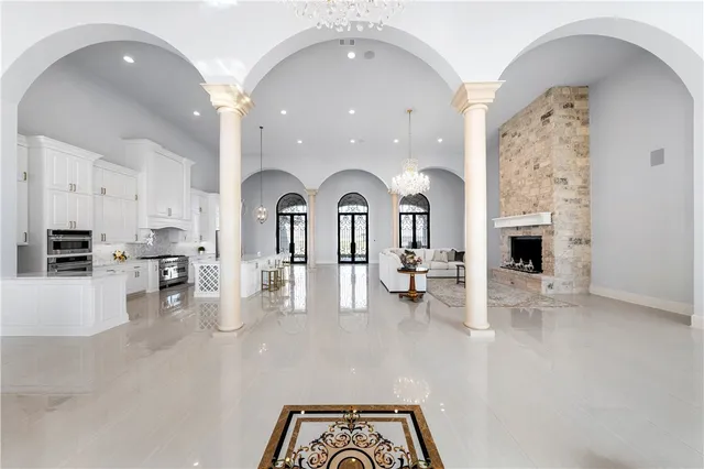 a spacious bedroom with a large bed and a window